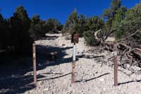48-looking_back_to_Sawmill_48B-barriers_blocking_access_to_dirt_road