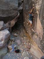 009-Rodney_putting_a_rock_in_the_highest_hole