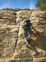 33-Eric_climbing_up_a_wall_with_good_handholds