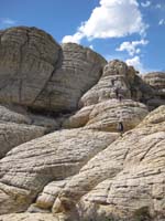 52-good_picture_of_the_group_walking_down_the_terrain_from_the_peak-from_Harlan