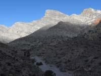 07-now_to_descend_into_wash_heading_towards_right_sloped_portion_of_Turtlehead_Peak