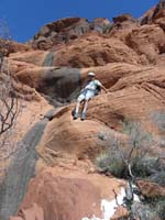 61-Eric_climbing_down_slick_rock_from_dry_waterfall