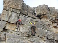 28-Luba_and_Ed_climbing-Laszlo_learning_we_need_to_take_packs_off_for_that_crack_to_climb