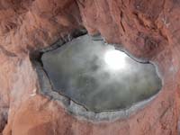 51-fooling_around_taking_picture_of_sun_reflecting_small_pool_of_water-from_Luba