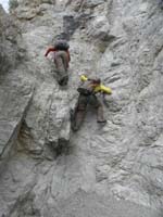 53-Luba_and_Ed_scrambling_down_wall