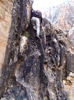 09-Jim_leading_up_the_almost_class_5_wall,but_with_lots_of_handholds-'It_gets_your_attention'