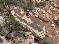 12-me_on_the_steep_rock_looking_at_the_dinosaur_tracks-from_Jim_Boone