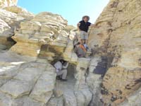 24-kids_pause_to_play_in_a_weathered_cave-James_admires_scenery