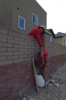 01-Mike_and_I_starting_the_hike_by_climbing_over_the_wall_behind_my_house