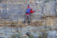 11-Luba_scrambling_up_the_cliff_band