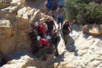 58-carefully_scrambling_rocks_carrying_the_injured_hiker