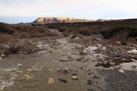 17-river_flowing_with_sun_finally_coming_out_illuminating_Blue_Diamond_Hill