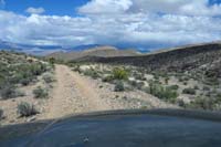 58-driving_along_dirt_road_avoided_tight_spot_to_left_and_slot_canyon_to_right