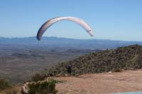 048-away_he_goes_enjoying_a_paragliding_experience_off_the_mountain