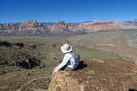 013-Kenny_sits_on_the_edge_of_Muffin_Peak_enjoying_the_scenic_view