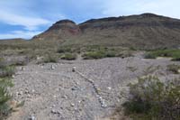 088-rock_cairns_through_wash_designating_the_Tunneling_into_Red_Rock_Trail