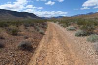 45-looking_west_to_dirt_road_leading_to_Red_Rock_Campground_in_1.4_miles
