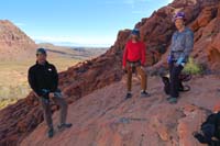 02-Brett_ready_to_rappel_through_Calico_Arch-bolted_anchor,Mike_and_Patti_are_next