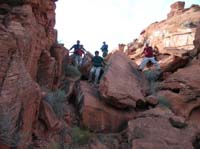 12-group_climbing_down_boulders