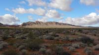 02-pretty_scenery_with_afternoon_sun-trail_to_left_of_mountains_ahead_and_then_to_right_behind_them