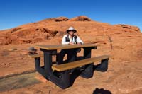 45-Daddy_sitting_at_one_of_the_tables,kids_on_peak_in_distance_playing-Brett_and_I_explored