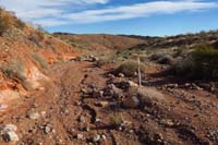 27-continue_along_wash_marked_with_more_uncapped_PVC_trail_markers