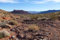 29-trail_continues_along_wash-opens_up_to_Valley_of_Fire_Peak_in_distance_left