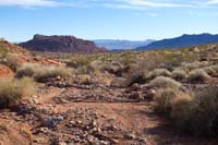 30-pretty_scenery_along_wash-opens_up_to_Valley_of_Fire_Peak_in_distance_left