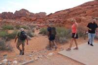 02-Nick_leading_two_guests_heading_off_trail_at_the_trailhead
