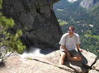 32-Chris_on_the_ledge-over_1400_feet_to_next_ledge-over_2400_above_valley
