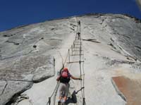 24-Luba_starts_the_trek_up_the_cables