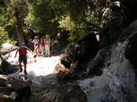 35-Luba_traversing_the_stream_in_the_middle_of_the_trail