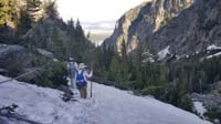 71-Daddy_leading_the_way_across_snowfield,Kenny_follows