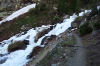 74-heading_down_the_trail_next_to_cascading_waterfall