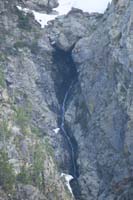 77-zoom_of_cascading_waterfall_under_rock_fall