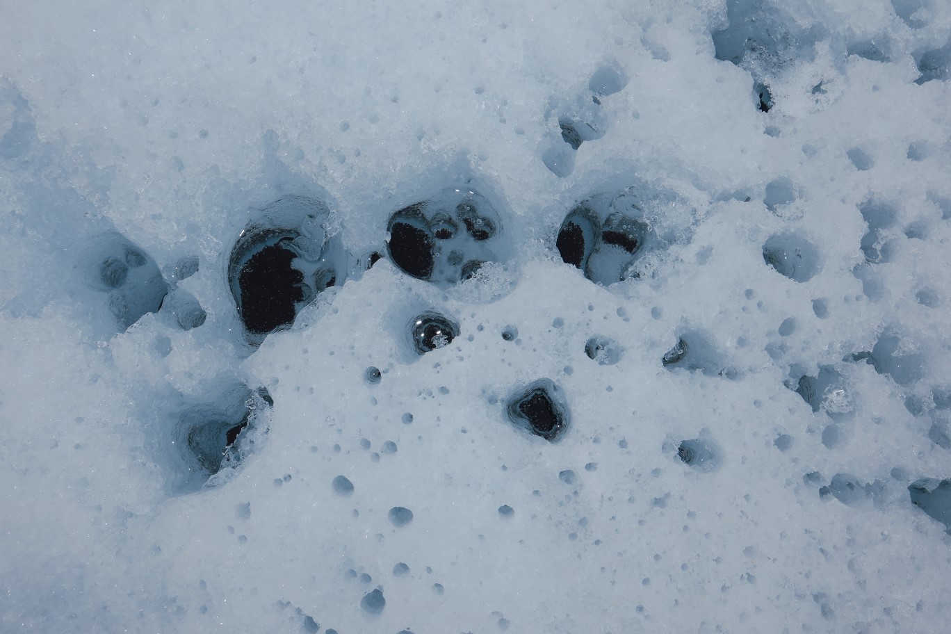 093-glacial-feature-rocks_melted_snow,then_refreezes