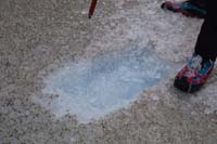 034-guide_shows_just_below_the_soot_layer_on_the_ice_is_blue_ice